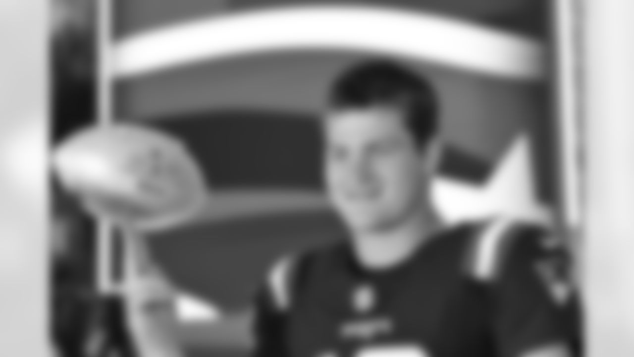 Patriots QB Drake Maye poses during 2025 media day.