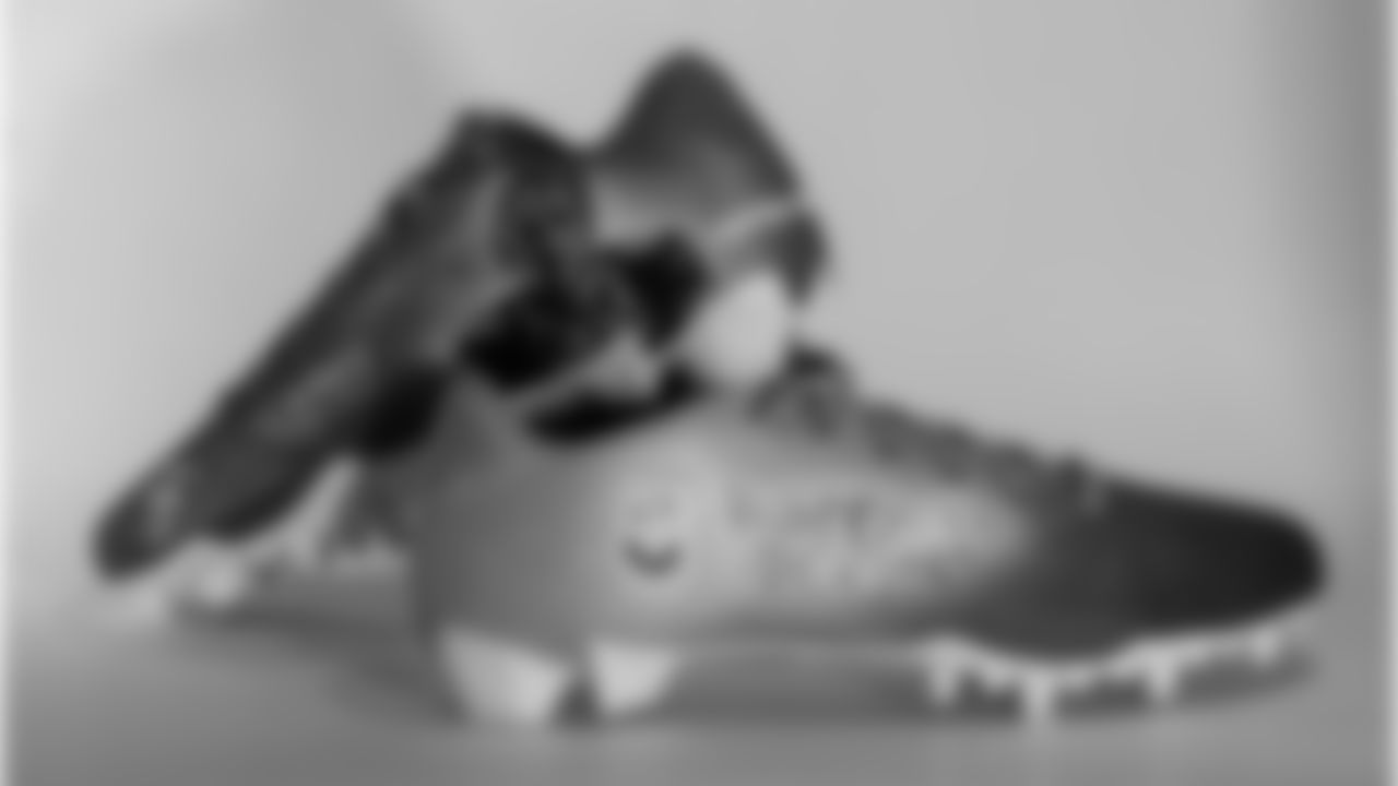 Christian Gonzalez's cleats supporting Kyle Cares and Happiness Project.