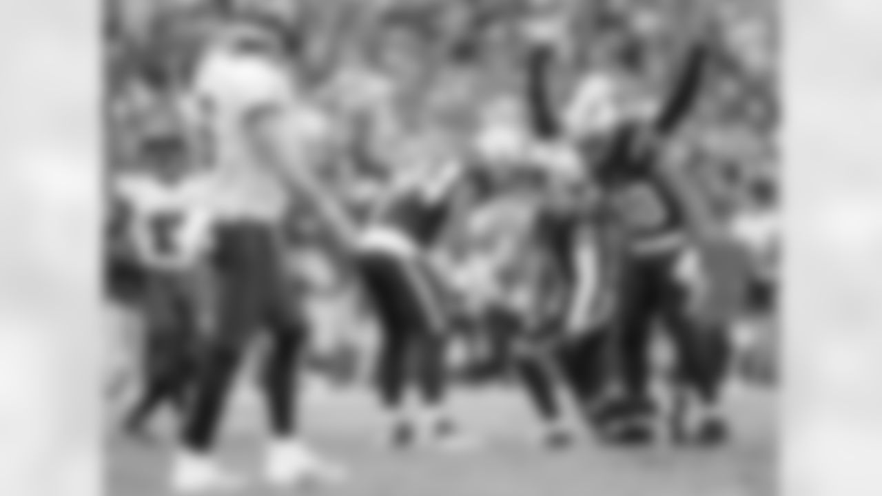 K'Lavon Chaisson, Christian Gonzalez and Jahlani Tavai