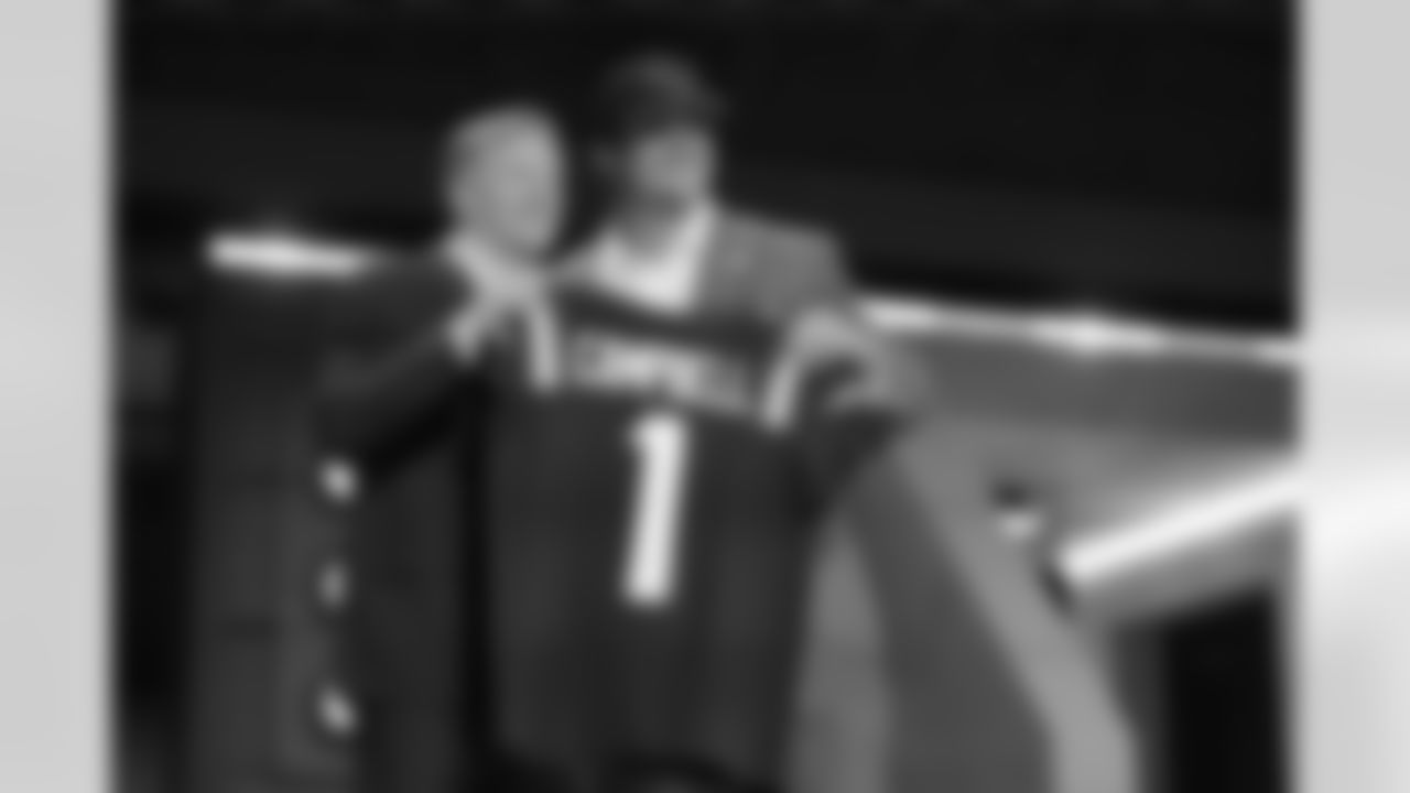 LSU offensive tackle Will Campbell, right, poses with NFL Commissioner Roger Goodell after being chosen by the New England Patriots with the fourth overall pick during the first round of the NFL football draft, Thursday, April 24, 2025, in Green Bay, Wis. (AP Photo/Jeff Roberson)