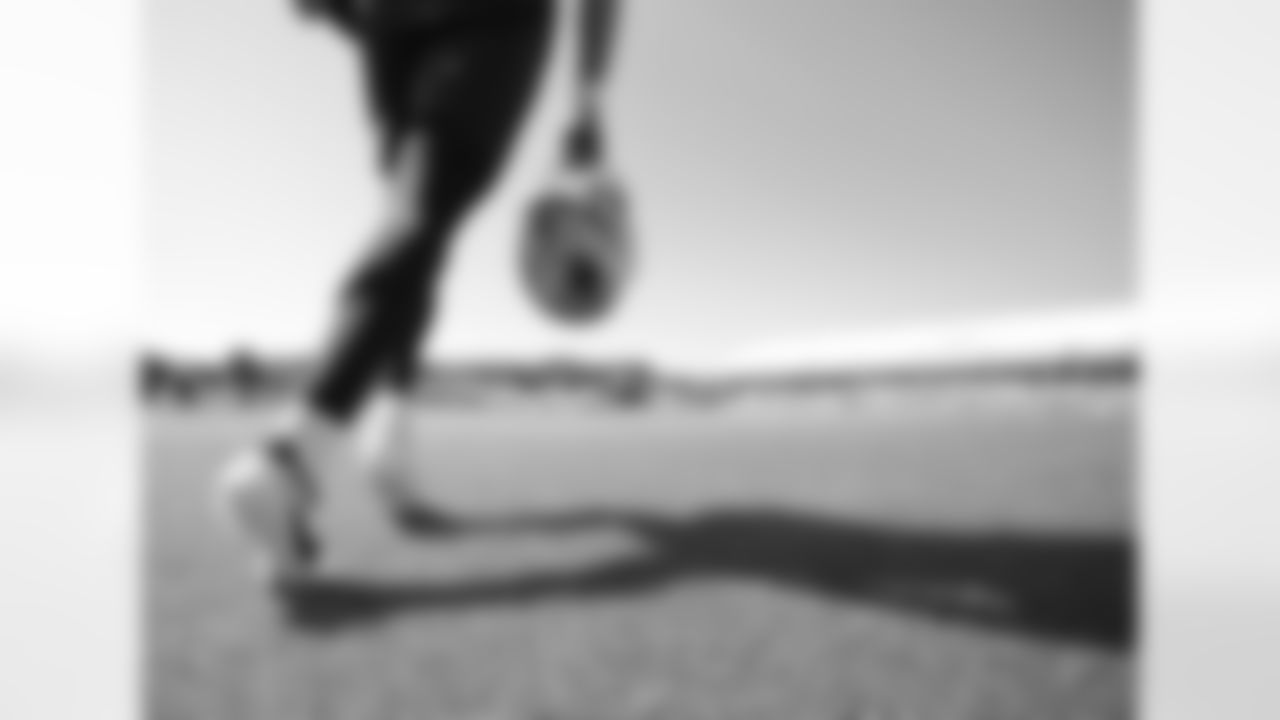 A Patriots player runs onto the field during Patriots Training Camp on July 26, 2024,