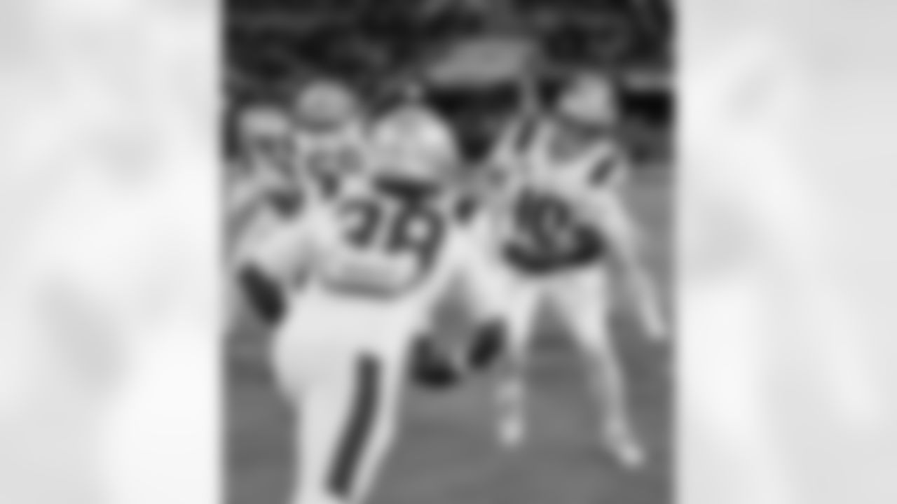 Rhamondre Stevenson and Drake Maye. Photo by Eric J. Adler