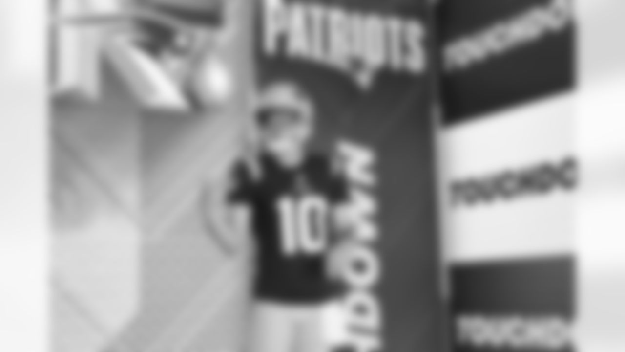 Patriots QB Drake Maye poses during 2025 media day.