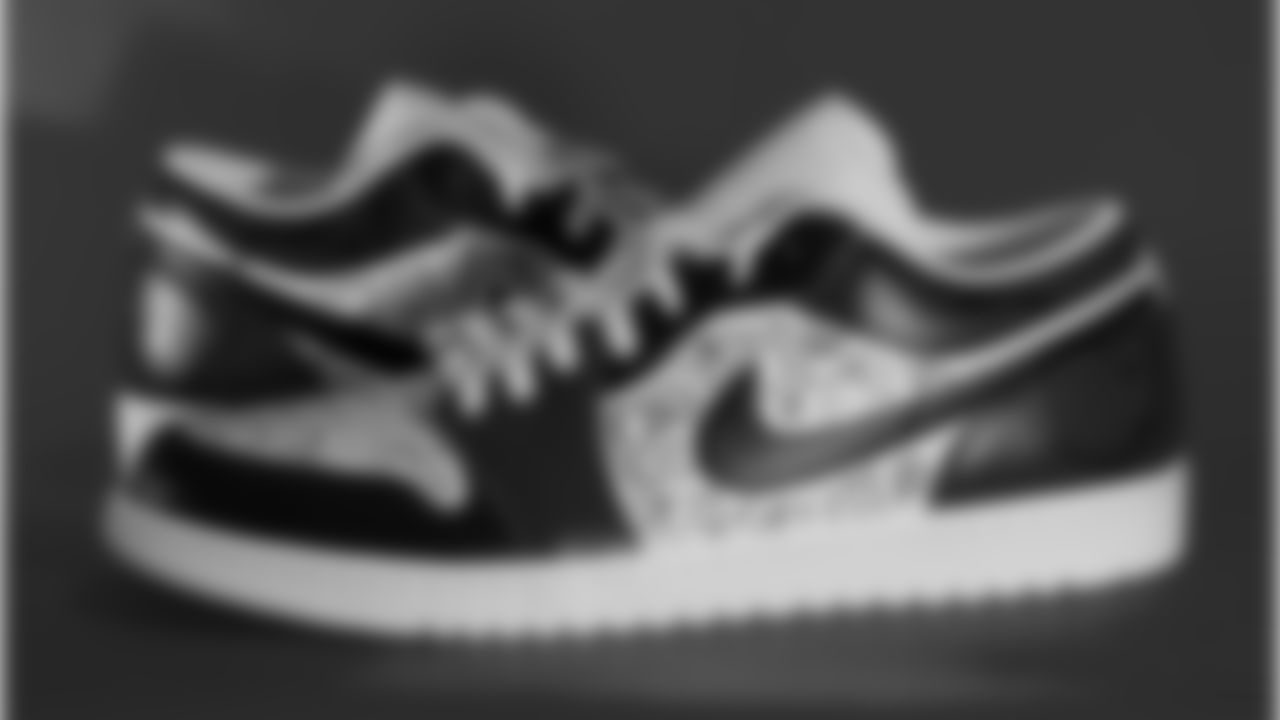 Offensive assistant Riley Larkin's sneakers supporting Ben Curtis Foundation