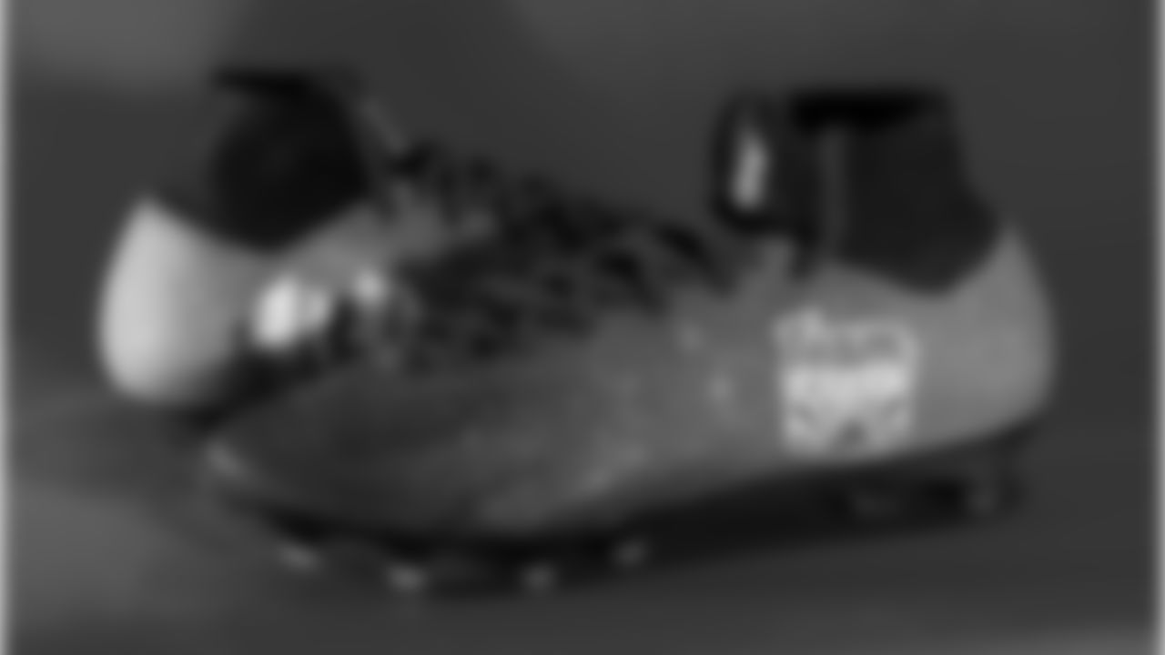 Andy Borregales cleats supporting Team Impact.