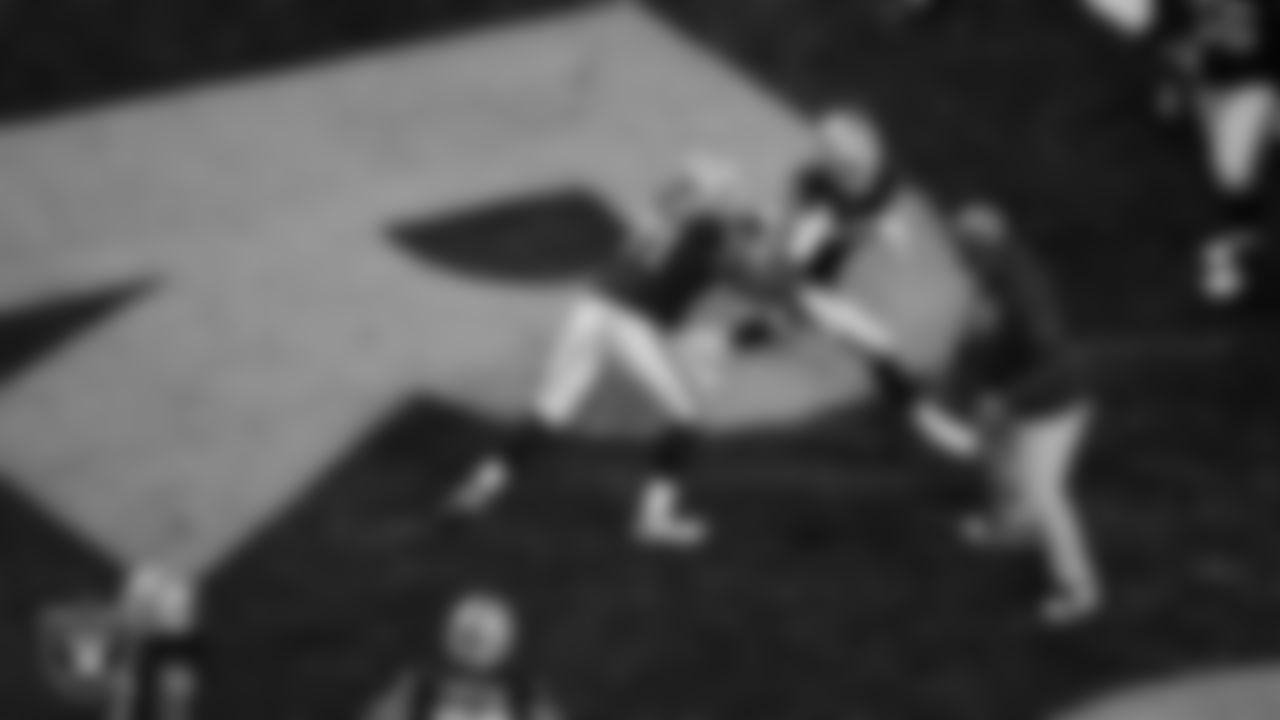 Las Vegas Raiders tackle DJ Glaze (71) and defensive end Maxx Crosby (98) warming up before the regular season home game against the Dallas Cowboys at Allegiant Stadium.