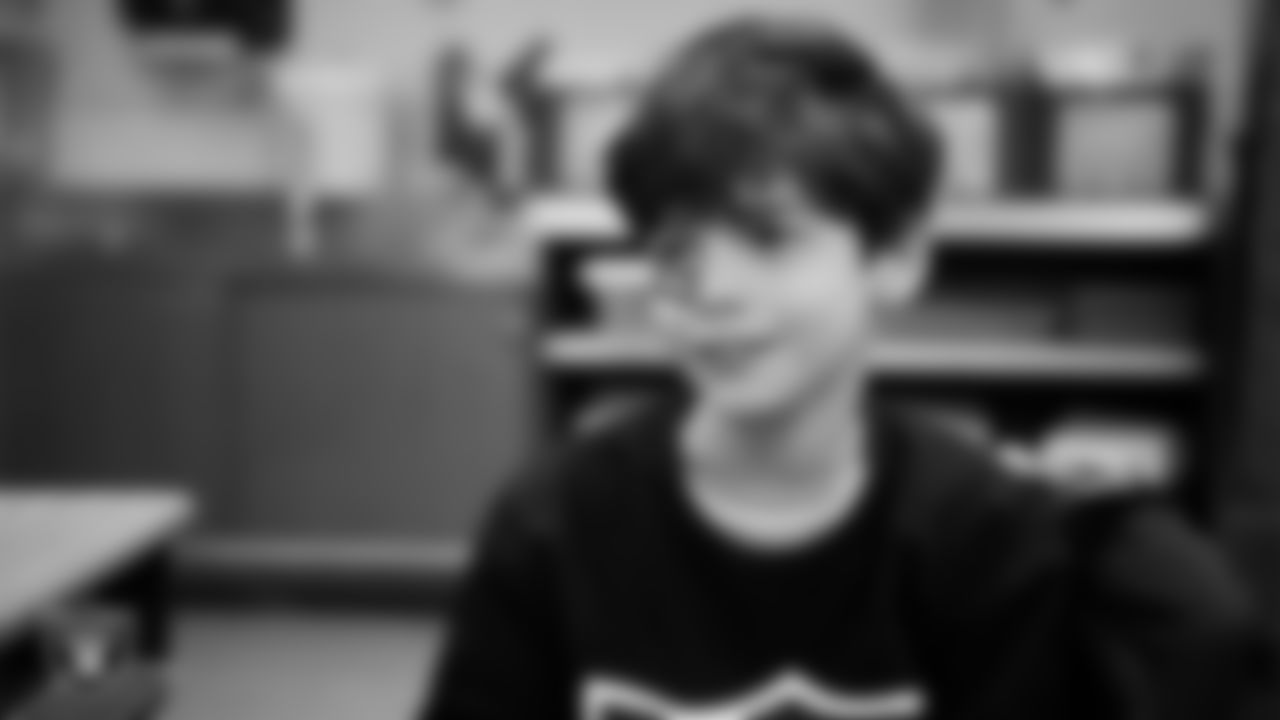 A student celebrates winning the Lil' Raiders School Challenge at Matt Kelly Elementary School.