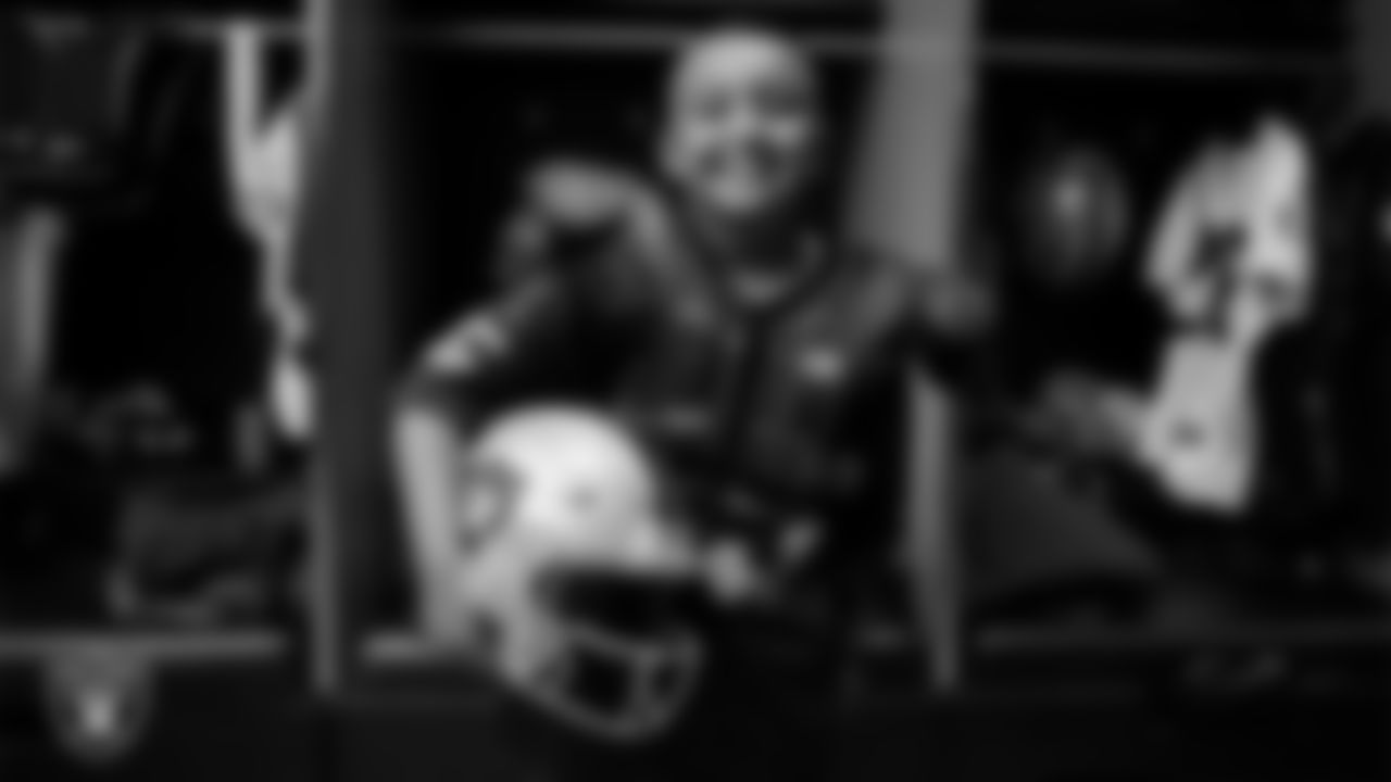 Christopher Arias from Make-A-Wish poses for a photo in the locker room during a visit to Intermountain Health Performance Center.