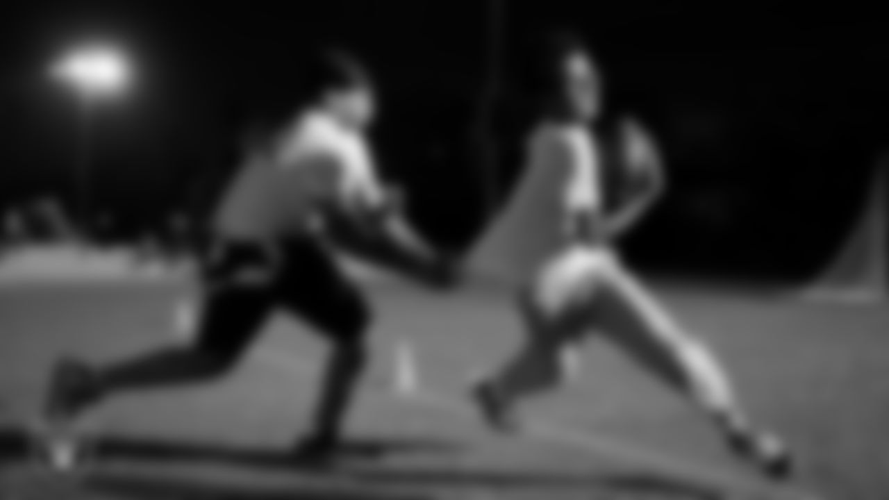 Athletes take part in a Silver and Black League flag football clinic at Bill and Lillie Heinrich YMCA.