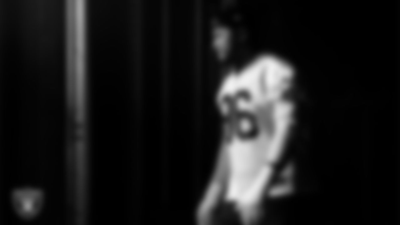 Las Vegas Raiders defensive tackle Jonah Laulu (96) walks out to the field for practice at Intermountain Health Performance Center.
