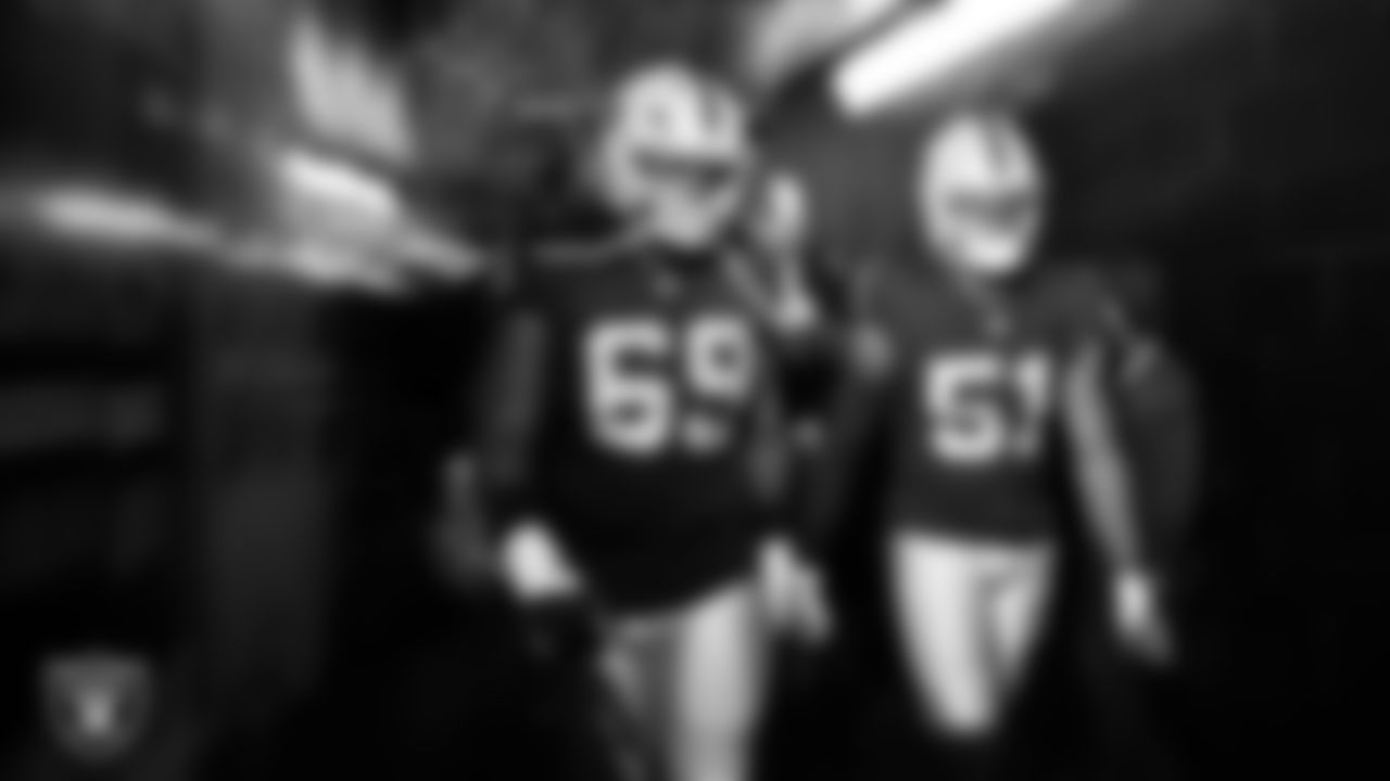 Las Vegas Raiders defensive tackle Adam Butler (69) and defensive end Malcolm Koonce (51) walk down the tunnel before the regular season home game against the Jacksonville Jaguars at Allegiant Stadium.