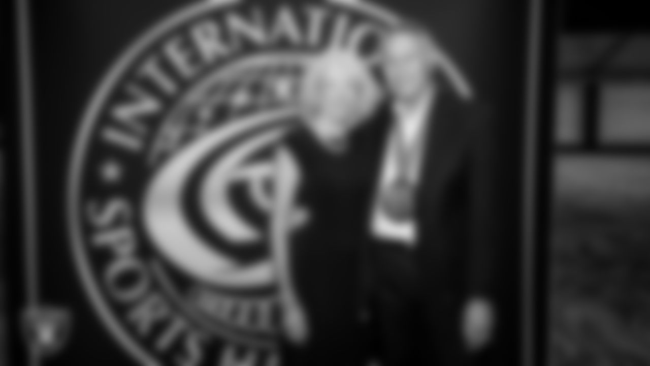 Las Vegas Raiders alumnus Jim Plunkett poses for a photo with his wife Gerry Plunkett during the International Sports Hall of Fame Induction Ceremony at Resorts World.