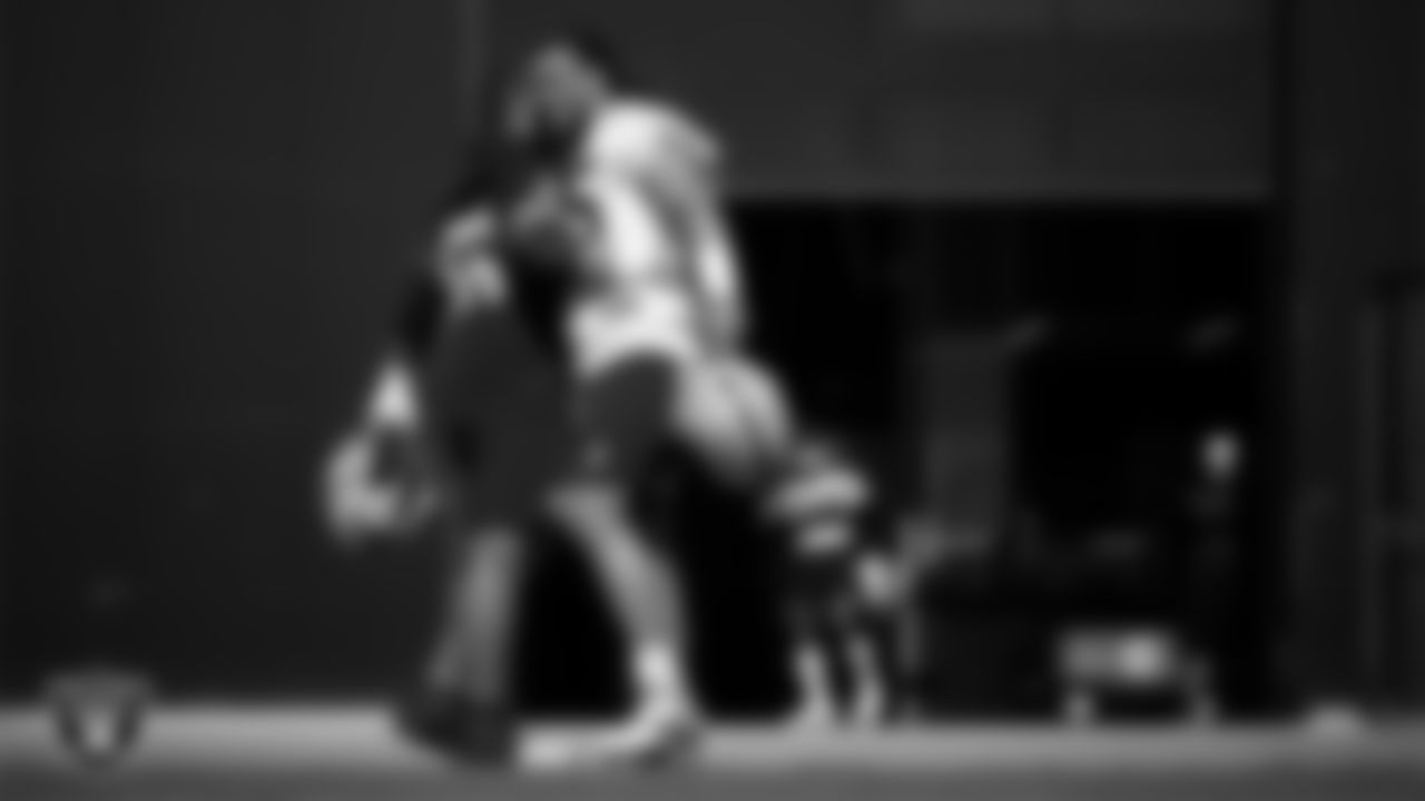 Las Vegas Raiders guard Atonio Mafi (56) and defensive tackle Leki Fotu (95) during practice at Intermountain Health Performance Center.