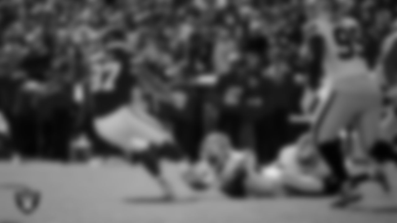 Las Vegas Raiders safety Isaiah Pola-Mao (20) makes a tackle during the regular season away game against the Kansas City Chiefs at GEHA Field at Arrowhead Stadium.