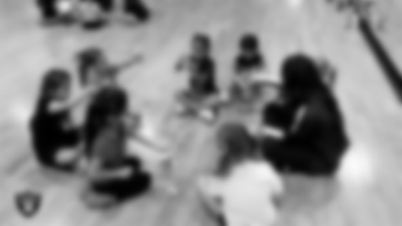 Raiderette Sloane and dancers do arts and crafts during day two of summer camp at The Studio.