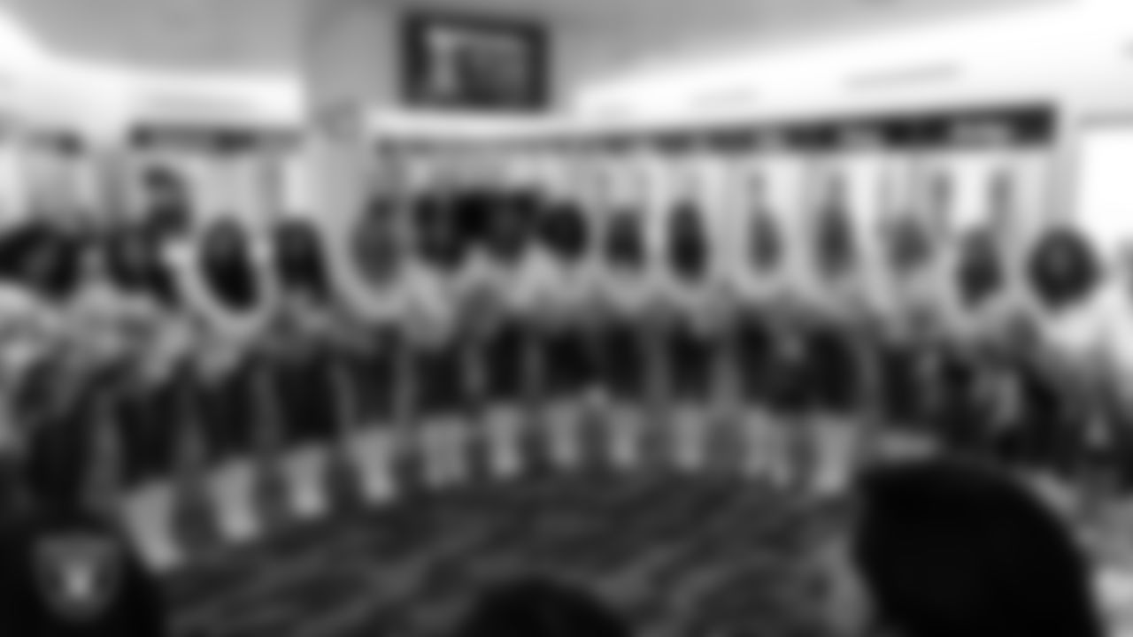 The Raiderettes huddle in the locker room before the regular season home game against the Denver Broncos at Allegiant Stadium.