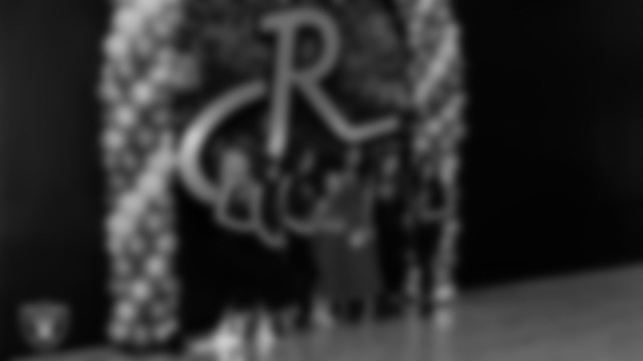 Raiderettes Delaney, Ashtin, Reagan, Lexie and Kylee pose for a photo with attendees during the Valentine's Day Dance at The Studio.