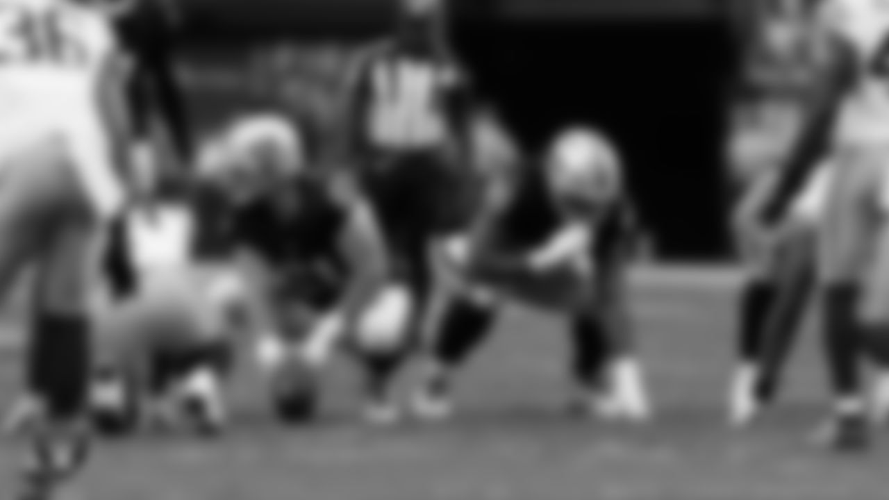 Las Vegas Raiders offensive lineman Jordan Meredith (61) and guard Dylan Parham (66) line up before the snap during the preseason home game against the San Francisco 49ers at Allegiant Stadium.