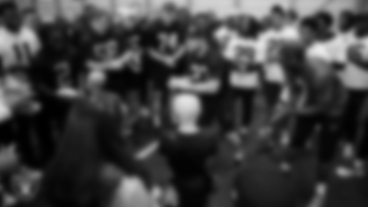 The Las Vegas Raiders huddle with Intermountain Children's Health patients at Intermountain Health Performance Center.