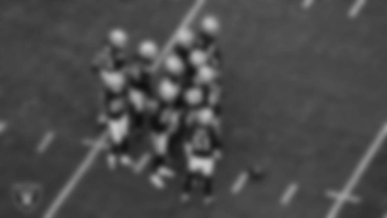 The Las Vegas Raiders defense huddles during the regular season home game against the New York Giants at Allegiant Stadium.
