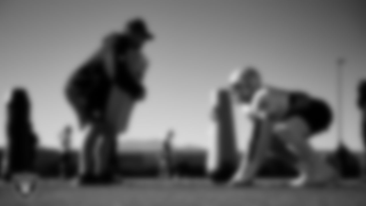 Las Vegas Raiders defensive assistant Rip Rowan and defensive end Maxx Crosby (98) during practice at Intermountain Health Performance Center.