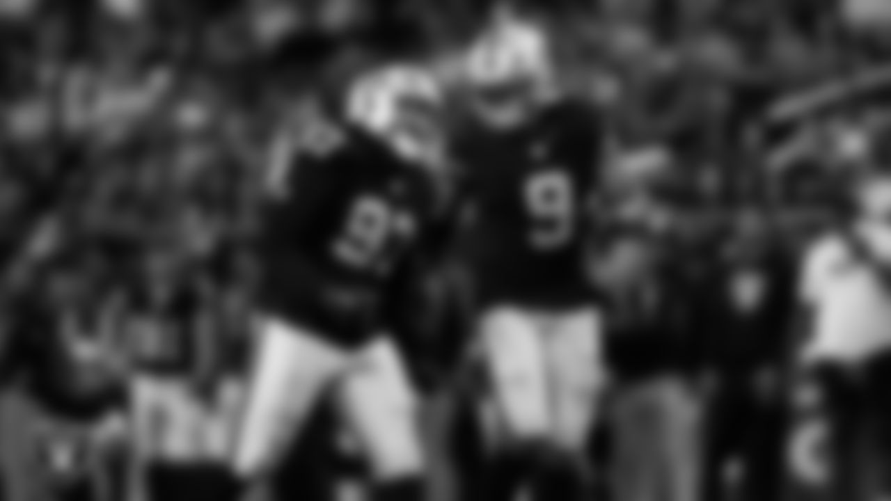 Las Vegas Raiders defensive tackle Tonka Hemingway (97) celebrates with defensive end Tyree Wilson (9) after sacking the quarterback during the regular season home game against the Kansas City Chiefs at Allegiant Stadium.