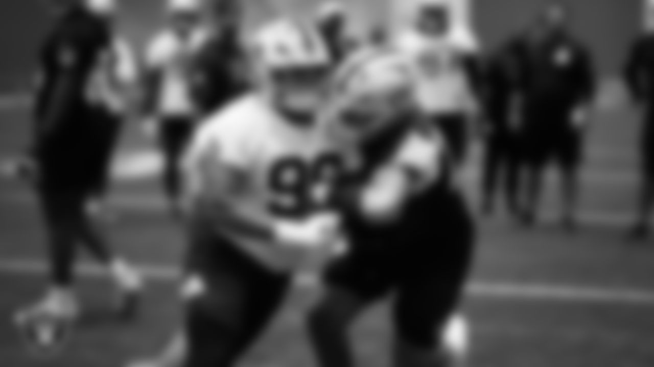 Las Vegas Raiders defensive tackle Jonah Laulu (96) and guard Caleb Rogers (76) during practice at Intermountain Health Performance Center.