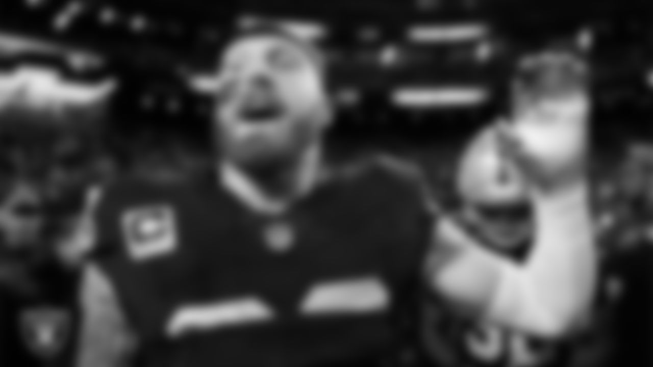 Las Vegas Raiders defensive end Maxx Crosby (98) in a huddle before the regular season home game against the Dallas Cowboys at Allegiant Stadium.