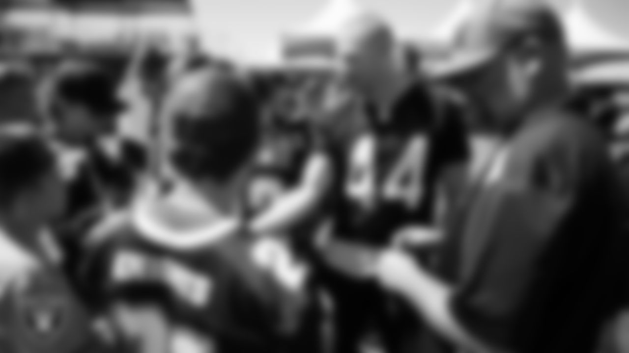 Las Vegas Raiders linebacker Tommy Eichenberg (44) speaks to the Round Mountain High School football team during a 2025 Training Camp practice at Intermountain Health Performance Center.
