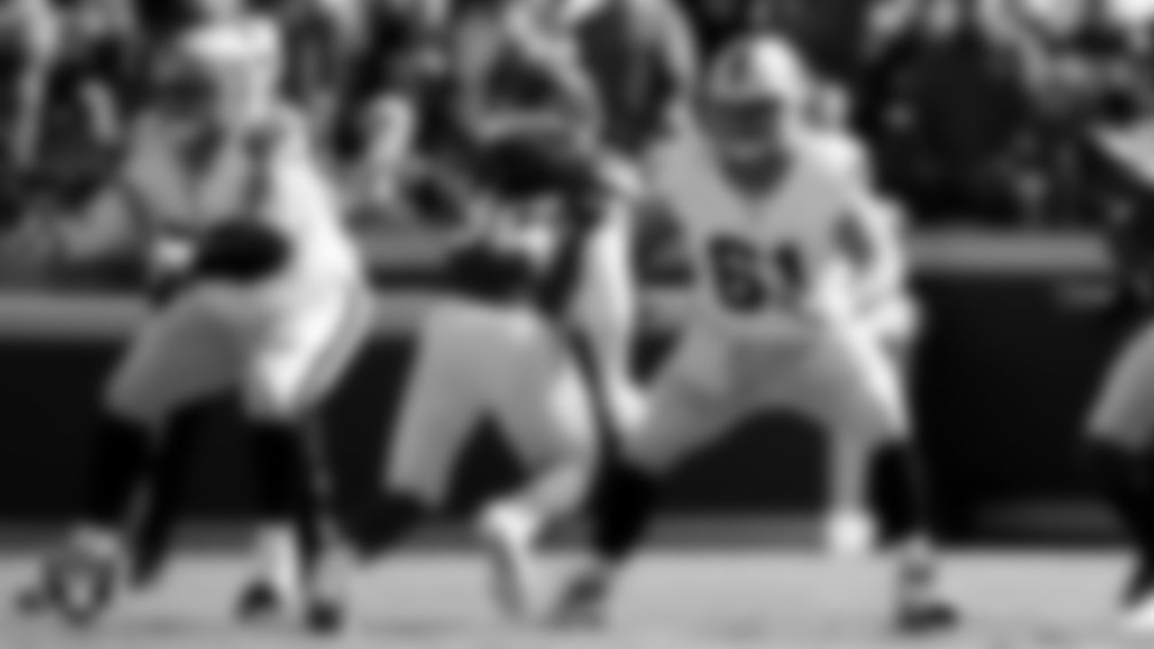 Las Vegas Raiders guard/center Jackson Powers-Johnson (58) and center/guard Jordan Meredith (61) during the regular season away game against the Kansas City Chiefs at GEHA Field at Arrowhead Stadium.
