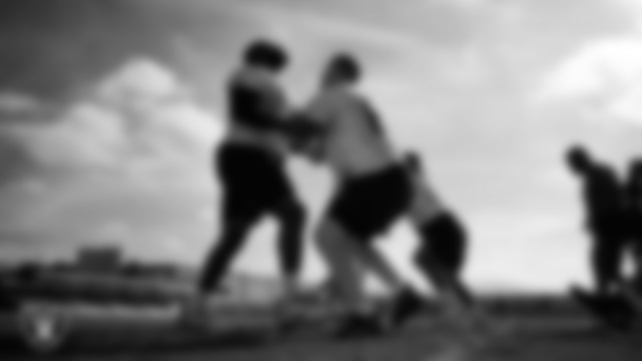 Las Vegas Raiders guard McClendon Curtis (63) and center Will Putnam (67) during practice at Intermountain Health Performance Center.