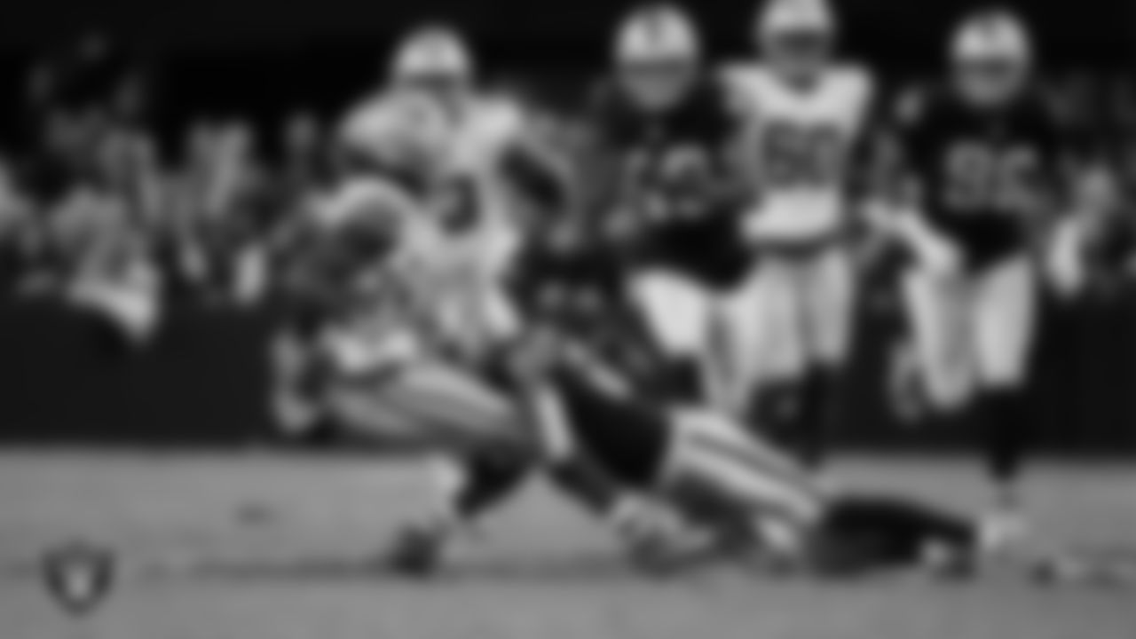 Las Vegas Raiders safety Isaiah Pola-Mao (20) makes a tackle during the regular season home game against the Dallas Cowboys at Allegiant Stadium.