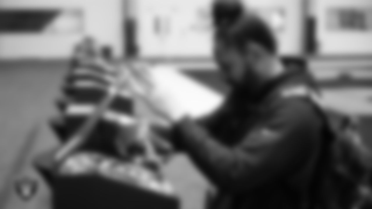 Las Vegas Raiders linebacker Kana'i Mauga (43) unboxes his custom cleats for the NFL's My Cause My Cleats initiative at Intermountain Health Performance Center.