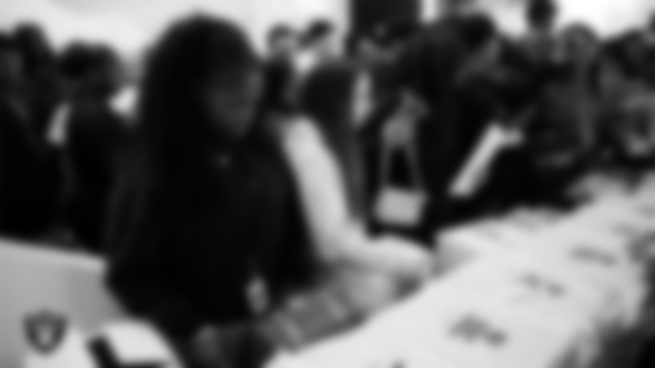 Canyon Springs High School students receive Las Vegas Raiders gear after the Employee Resource Group Mentorship Program at Las Vegas Raiders Headquarters.