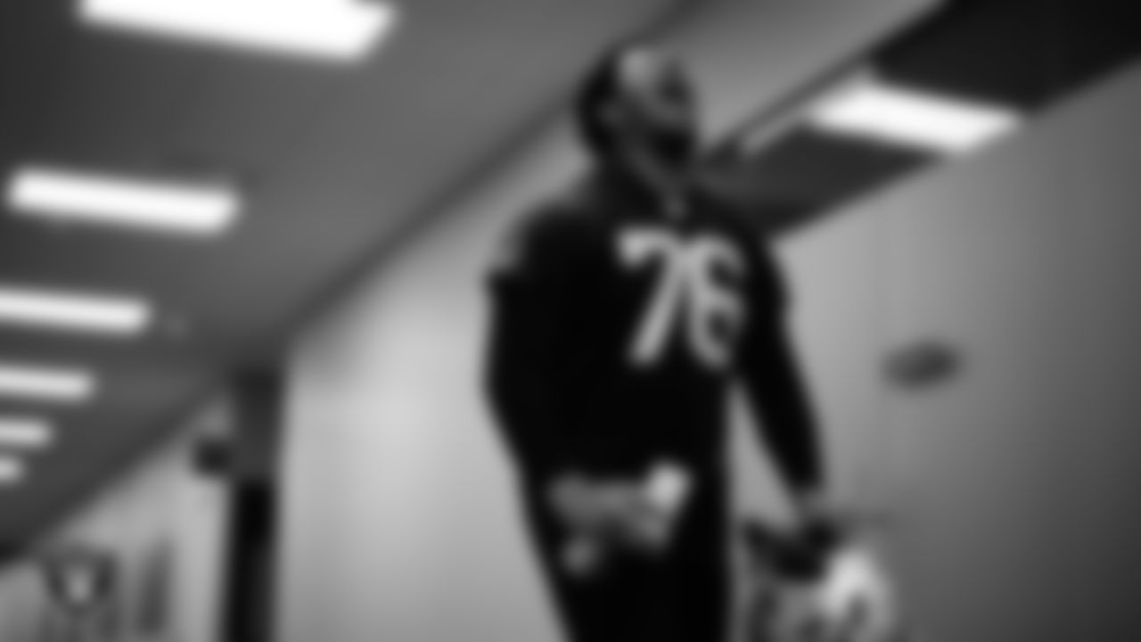 Las Vegas Raiders guard Caleb Rogers (76) walks out to the field for practice at Intermountain Health Performance Center.