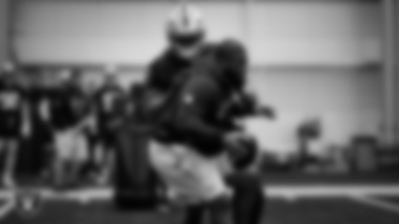Las Vegas Raiders defensive end Tyree Wilson (9) and assistant defensive line coach Kenyon Jackson during practice at Intermountain Health Performance Center.