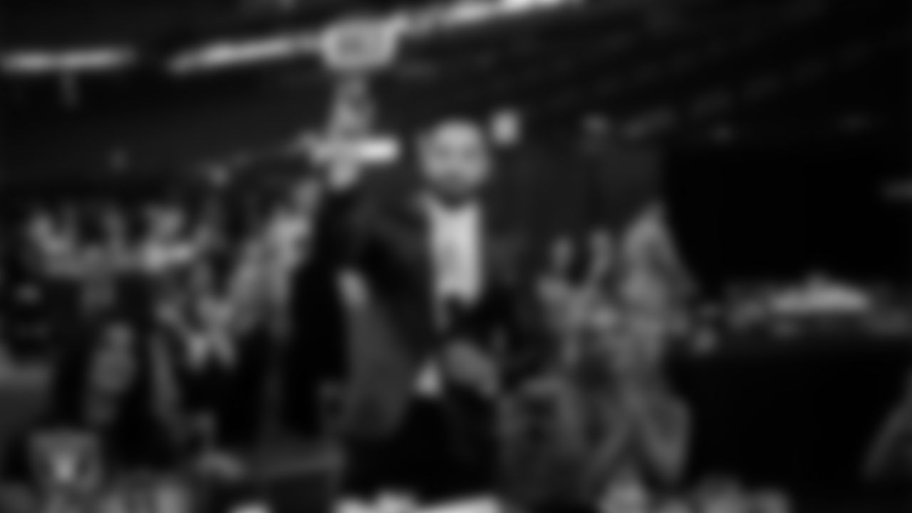 Attorney Farhan Naqvi of Naqvi Injury Law during an auction at the second annual Silver & Black Gala hosted by The Raiders Foundation at Allegiant Stadium.