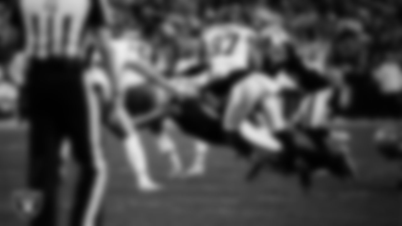 Las Vegas Raiders defensive end Tyree Wilson (9) forces a fumble during the regular season home game against the Kansas City Chiefs at Allegiant Stadium.