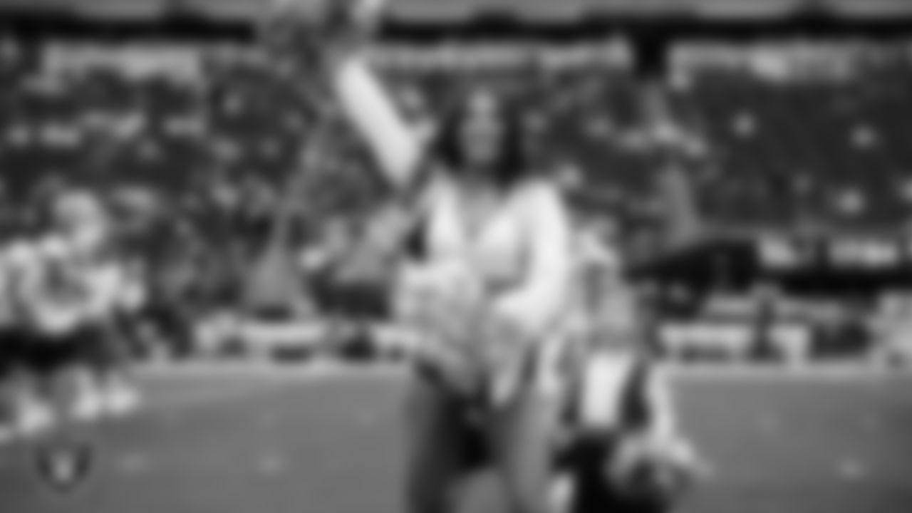 Raiderette Ashtin and Junior Raiderettes perform on the field before the preseason home game against the San Francisco 49ers at Allegiant Stadium.
