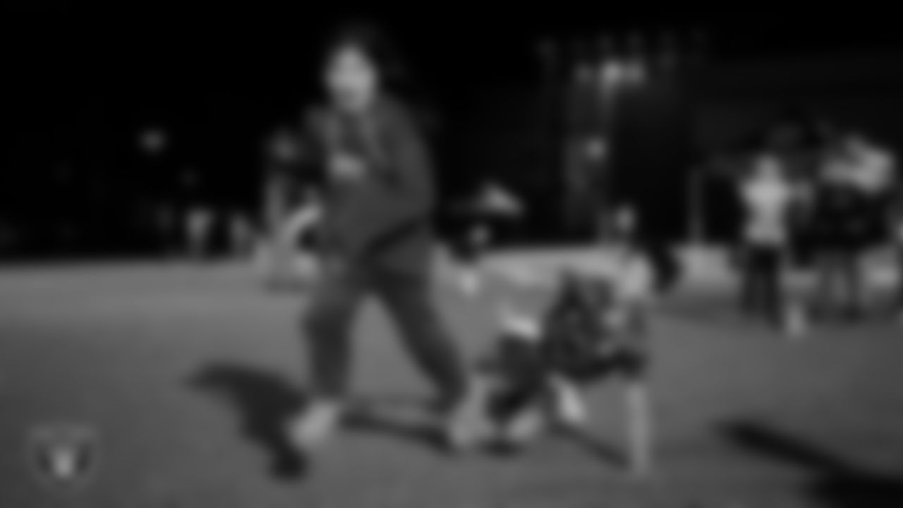 Athletes take part in a Silver and Black League flag football clinic at Bill and Lillie Heinrich YMCA.