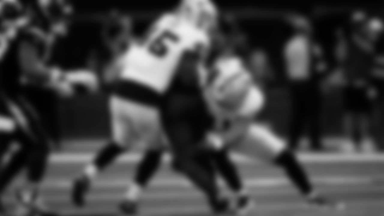 Las Vegas Raiders linebacker Devin White (45) and safety Jeremy Chinn (11) make a tackle during the regular season away game against the Los Angeles Chargers at SoFi Stadium.