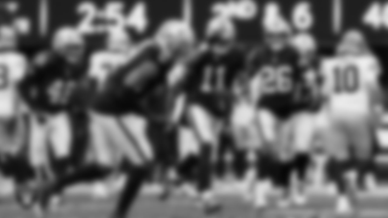 Las Vegas Raiders safety Jeremy Chinn (11) celebrates with teammates after intercepting a pass during the preseason home game against the San Francisco 49ers at Allegiant Stadium.