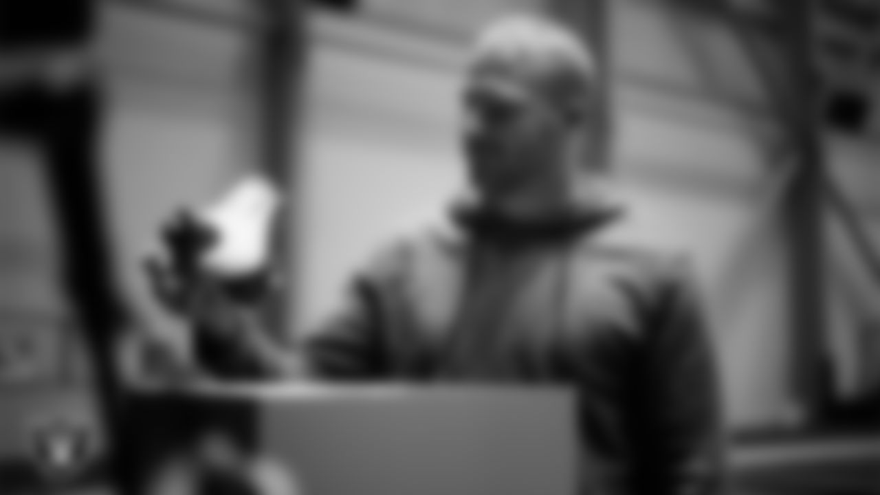 Las Vegas Raiders linebacker Tommy Eichenberg (44) unboxes his custom cleats for the NFL's My Cause My Cleats initiative at Intermountain Health Performance Center.