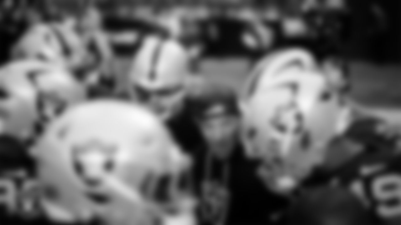 The Las Vegas Raiders defensive linemen huddle before the regular season home game against the Denver Broncos at Allegiant Stadium.