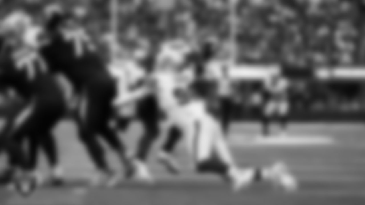 Las Vegas Raiders defensive end Maxx Crosby (98) sacks the quarterback during the regular season away game against the Los Angeles Chargers at SoFi Stadium.