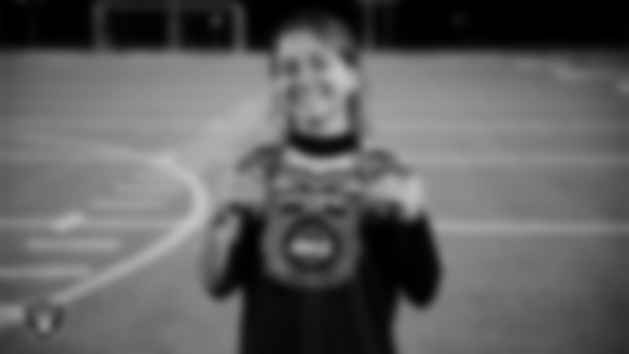 Bonanza High School quarterback Crystal Solis (33) poses with the MVP chain after the Las Vegas Raiders' High School Flag Football Showcase game at Bonanza High School.