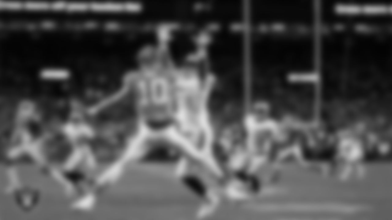 Las Vegas Raiders defensive tackle Jonah Laulu (96) pressures the quarterback during the regular season away game against the Denver Broncos at Empower Field at Mile High.