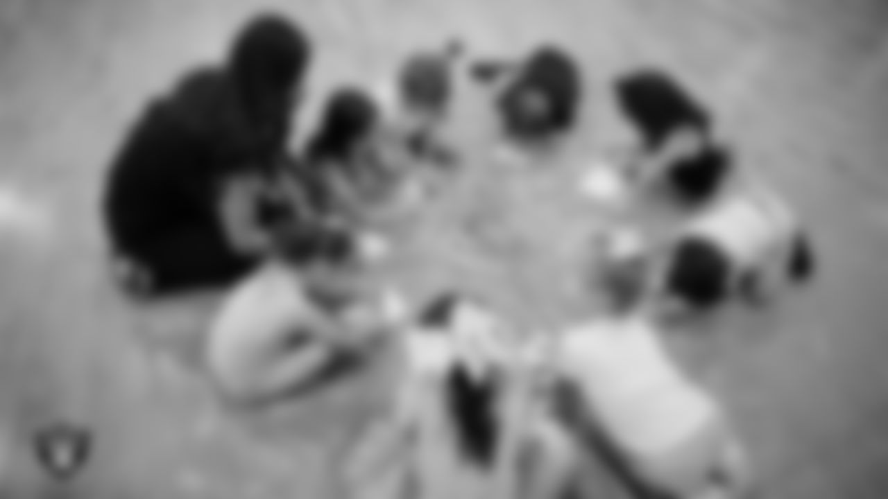 Raiderette Maddie colors with dancers during day one of summer camp at The Studio.