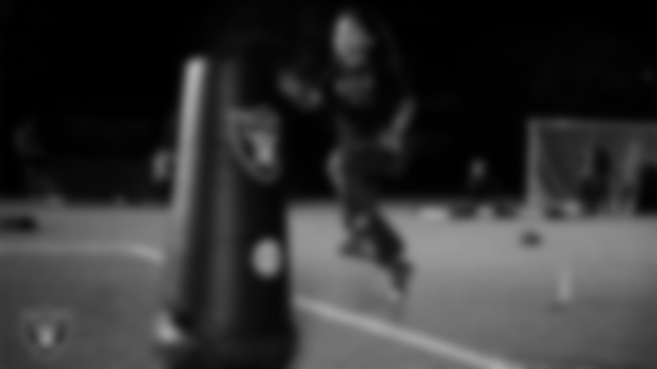 An athlete takes part in a Silver and Black League flag football clinic at Bill and Lillie Heinrich YMCA.