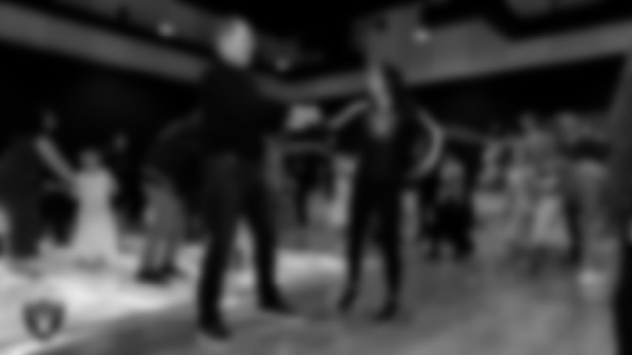 Raiderette Reagan and her father teach a dance during the Valentine's Day Dance at The Studio.